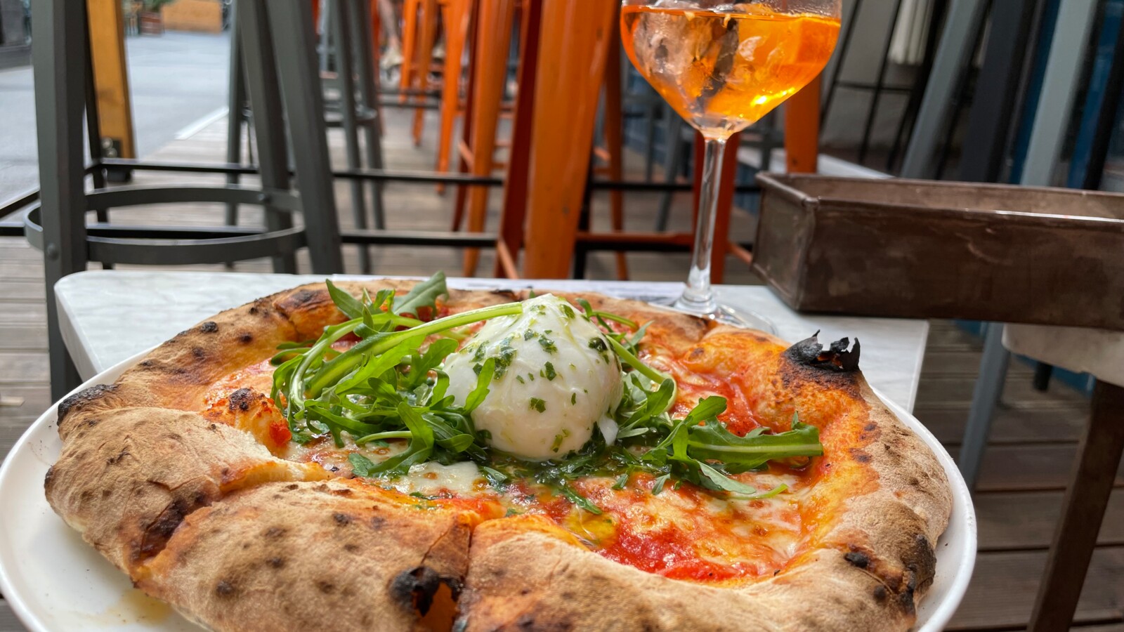 Delicious pizza and a refreshing cool drink at 87 MAMMA LINA by Gina's Pizza and Bar